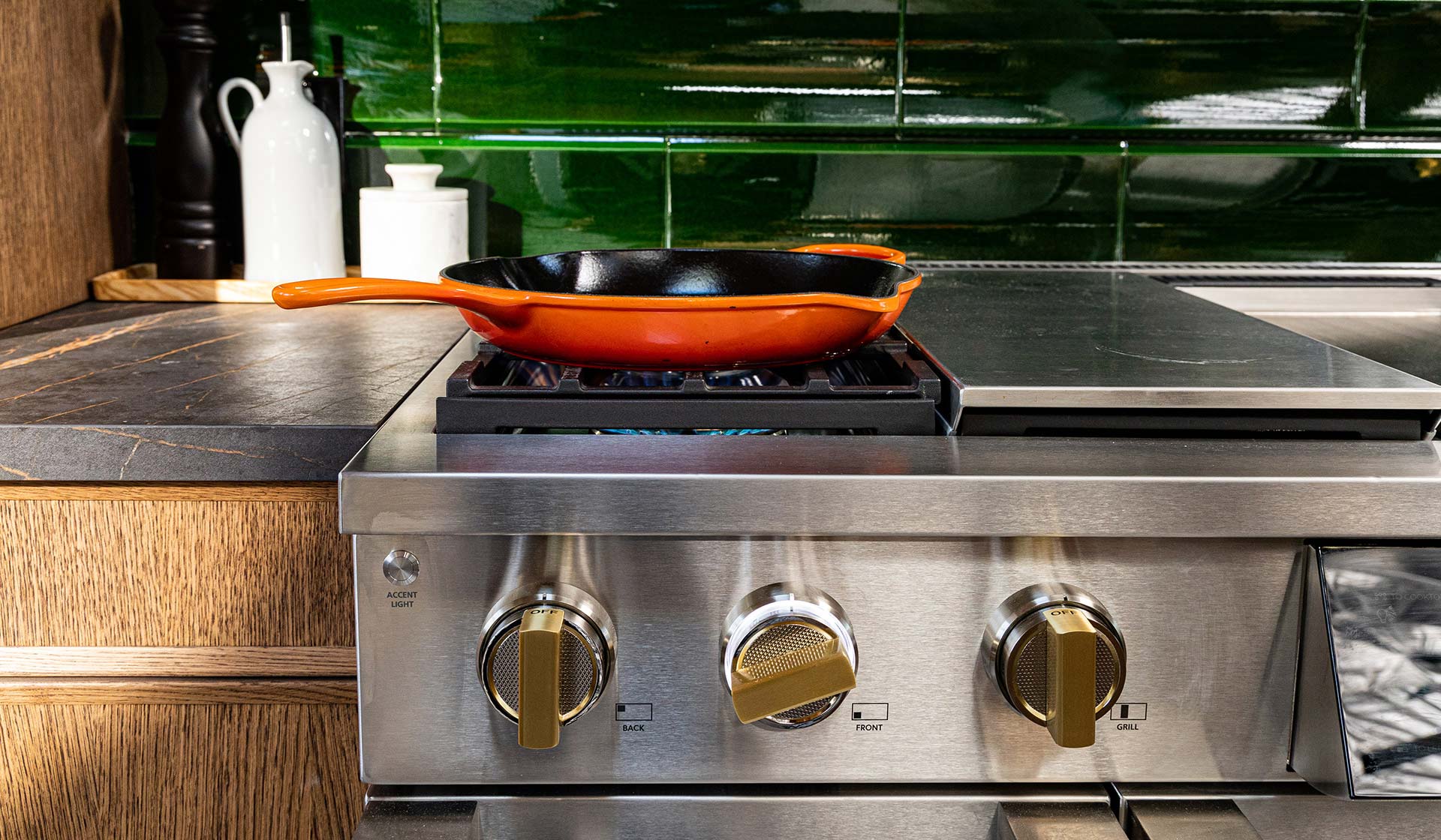 Professional range with green tile and orange pan